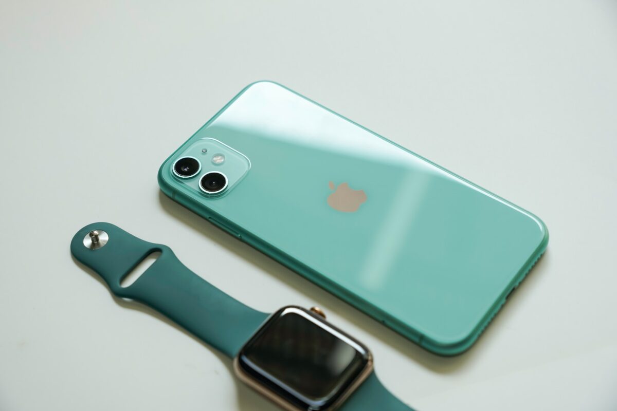 silver iphone 6 with blue sport band apple watch