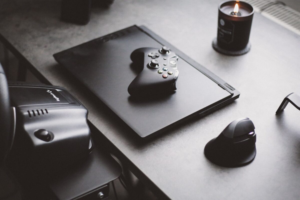 black and white xbox one controller beside black and white xbox one controller