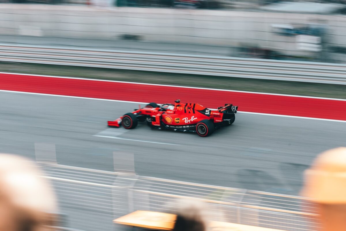 red and black go kart on road